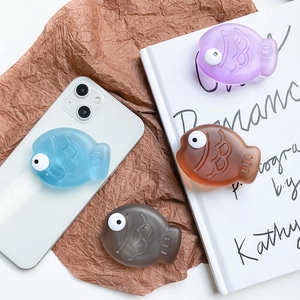 Detail of 3D resin fish-shaped phone grips in colorful translucent jelly textures