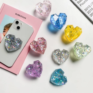 Macro shot of colorful glitter heart-shaped phone sockets with multifaceted resin surface