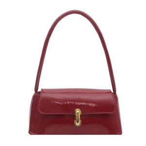 Retro bright red patent leather shoulder bag with a sleek gold metallic clasp closure