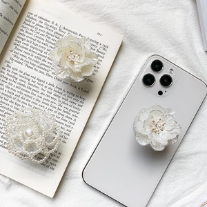 Elegant white 3D rose and pearl beaded phone grip socket on a white smartphone