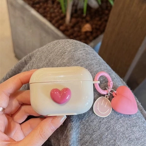 Creamy white silicone case for AirPods Pro featuring a 3D pink heart and cute charm
