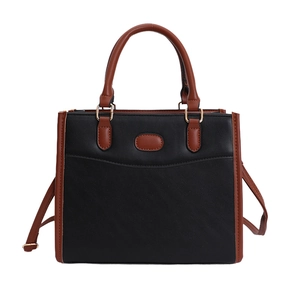Classic black and brown patchwork tote bag with gold hardware and long shoulder strap