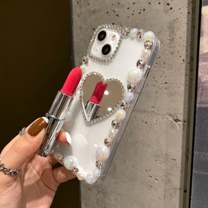 Detail showing pearl edges and heart mirror on luxury rhinestone iPhone case