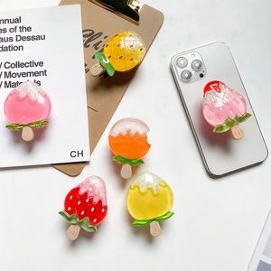 Detailed view of 3D fruit popsicle phone sockets on a white background with natural light