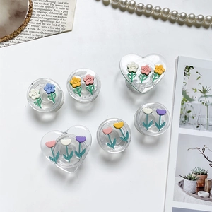 Chic tulip flower phone socket grip with transparent acrylic base on marble surface