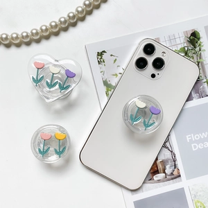 Detail of 3D tulip flower phone grip showing heart and round transparent expanding bases