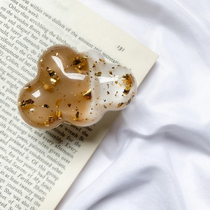 Cloud-shaped phone grip with amber resin gradient and embedded gold foil flakes