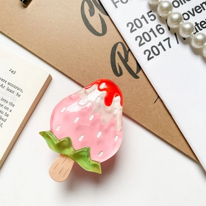 Macro shot of 3D strawberry ice cream phone socket with glossy finish and realistic detail