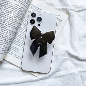 Support de téléphone avec nœud papillon noir minimaliste au style doux et élégant