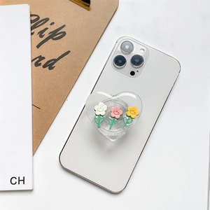 Floral heart phone grip featuring resin tulips on a clear base attached to a white phone