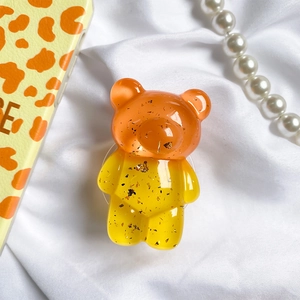 Cute gold foil resin bear phone grip with orange and yellow gradient glitter finish