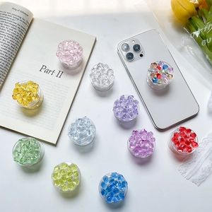 Foldable telescopic crystal gem phone socket stands in various vibrant colors and styles