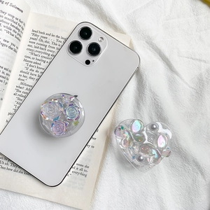 Laser holographic flower and heart butterfly griptok stands on a white desk
