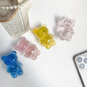 Detail shot of bear phone socket with glitter silver foil in colorful resin