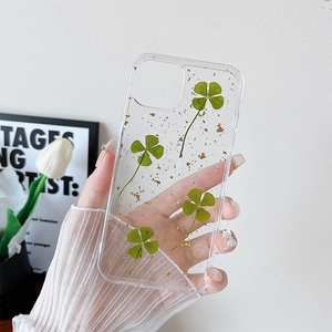 Custodia per iPhone trasparente con veri quadrifogli verdi e scaglie di foglia d'oro