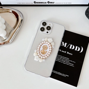 Detail of iPhone case featuring vintage cameo relief with pearls and resin roses