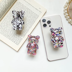 Cute bear glitter phone grip and stand made of resin with trendy ink and sparkle patterns