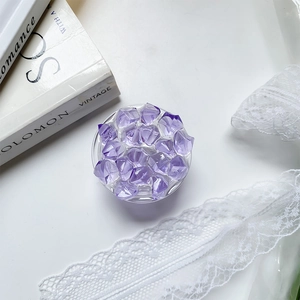 Detailed top view of a transparent phone grip featuring purple resin ice crystal design