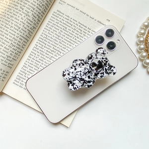 Black and white marble bear pop socket holder on a smartphone for stable grip