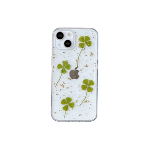 Custodia iPhone con veri quadrifogli pressati e scaglie di foglia d'oro in resina chiara