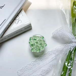 Detail of green crystal ice block texture on round foldable cell phone grip holder