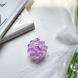 Detail shot of a purple crystal folding phone grip with faceted acrylic stones