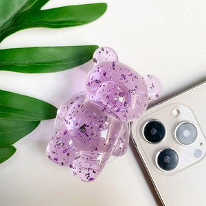 Detailed macro view of the clear purple bear phone grip with glitter and silver foil accents
