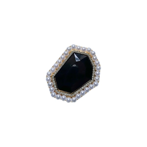 French vintage style brooch with black gemstone surrounded by pearls and rhinestones