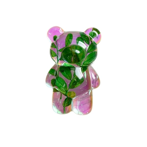 Creative laser iridescent bear phone grip with green leaf insert on white background