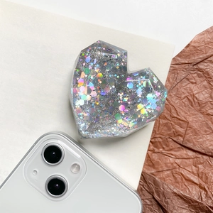 Collapsible heart-shaped phone grip with colorful iridescent sequins and facets