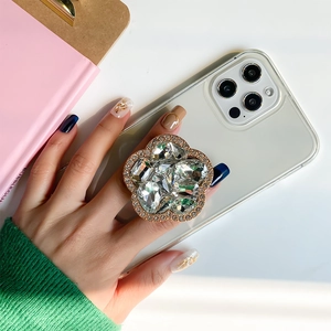 Detailed view of luxury flower shape crystal phone griptok with rose gold metal frame