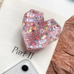 Pink heart-shaped phone grip featuring holographic sequins and 3D glitter texture