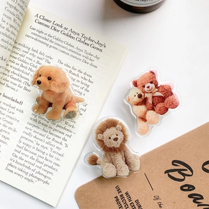 Detailed view of acrylic phone grips with realistic golden retriever and teddy bear prints