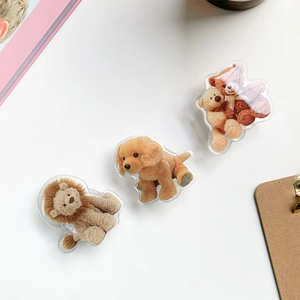 Close-up of cute 3D acrylic animal phone grips featuring lion, dog, and bear designs