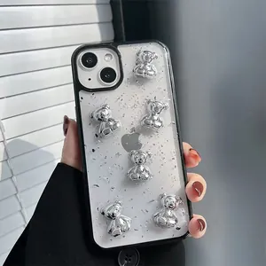 Close-up of iPhone case with silver 3D bears and sparkling silver foil glitter details