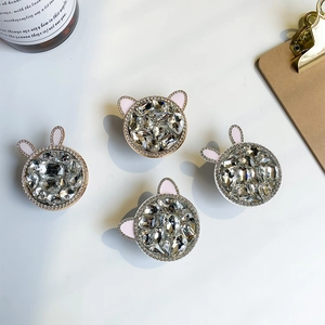 Close-up of sparkling rhinestone phone sockets with cute rabbit and bear ear designs