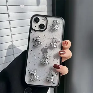 Detail of creative silver foil iPhone case featuring 3D electroplated bear decorations