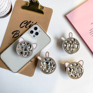 Close-up of luxury rhinestone rabbit ear phone socket grip with pink enamel and crystals