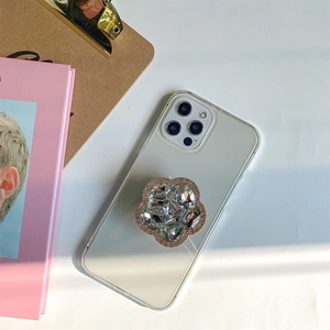 Luxury crystal flower pop socket on clear iPhone case with brilliant rhinestone details
