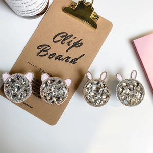 Detail of luxury rhinestone phone grips with cat and rabbit ears in various metal finishes