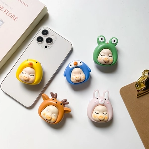 Detail view of colorful cartoon animal phone grips featuring cute pig face designs