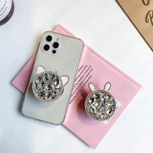 Detailed view of luxury rhinestone phone grips with pink rabbit and cat ears