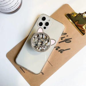 Close-up of luxury rhinestone cat ear phone socket holder on clear case