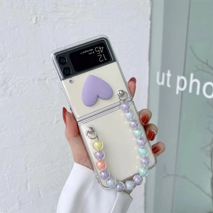 Detail of Z Flip folding case with purple heart and colorful bead charm chain strap