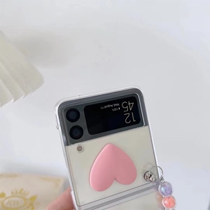 Close-up of Galaxy Z Flip case with pink heart kickstand and colorful beaded strap