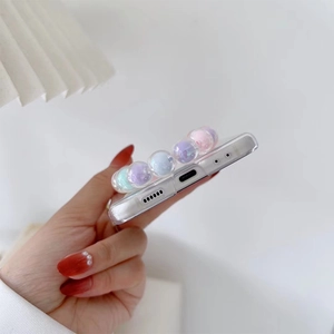 Detail of clear Samsung ZFlip3 case with colorful macaron beaded chain and precise cutouts