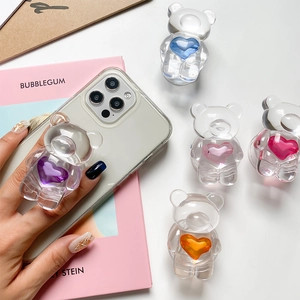 Detailed close-up of transparent bear-shaped pop-up phone sockets with colorful heart centers