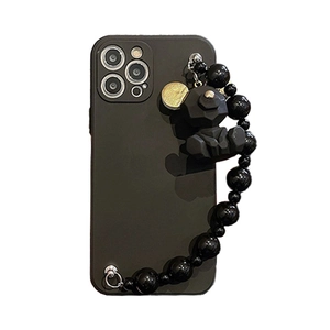 Black iPhone case with geometric bear charm and stylish beaded wrist strap accessory