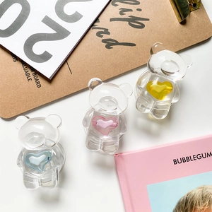 Detailed close-up of transparent bear phone grips with blue, pink and yellow heart centers