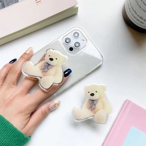 Cute teddy bear collapsible phone grip made of acrylic on a clear case for smartphones